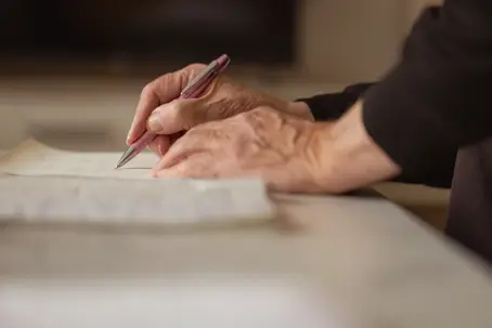 Close up shot of a senior man hands, writing in his old notebook.  Thank you This photo has been successfully downloaded. (Look for it in your Downloads folder or the last place you saved a file.) Having issues? Download again Customize this image  Credit:
